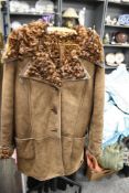 A vintage brown Antartex lamb skin jacket, having curly lining.