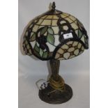 A modern Tiffany style side lamp with leaded light shade