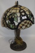 A modern Tiffany style side lamp with leaded light shade