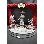 A modern Swarovski silver crystal glass figurine Masquerade set complete with stage, Pierrot,