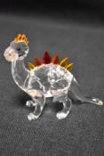 A modern Swarovski silver crystal glass figurine of a Dinosaur with box