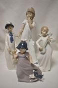 Three modern figurines by Nao with an additional Rex figure