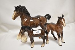 Three Beswick studies, Cantering Shire 975, Foals 951 & 1053, all brown