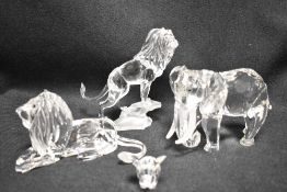 Four modern Swarovski silver crystal glass African animal studies including Elephant and Lions