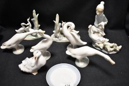 A selection of Lladro and Nao studies including girl with lamb