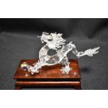 A modern Swarovski silver crystal glass figurine of a Chinese dragon