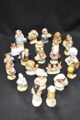 A selection of twenty three modern Beatrix Potter figurines all bearing the brown Beswick stamp