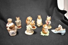 A collection of Beatrix Potter figures including Beswick & Royal Doulton