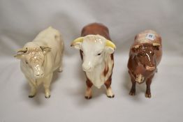 Three Beswick studies, Shorthorn Cow 1510, Hereford Bull 949 and Charolais Bull 2463A all with