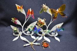 Twelve modern Swarovski silver crystal glass studies of bug or insect with display trees and boxes