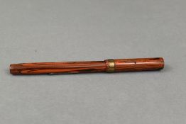 A Waterman Ideal 52 1/2 leverfill fountain pen in woodgrain pattern, 9ct gold band to clipless cap
