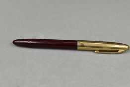 A Sheaffer Touchdown plunger fill fountain pen in red with gold cap having Sheaffer 14ct nib. Approx