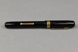 A Waterman Patrician leverfill fountain pen in black with filigree band to the cap having Waterman