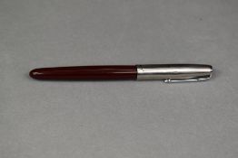 A Parker 51 fountain pen in burgundy with steel cap(small dent to cap) approx 13.7cm