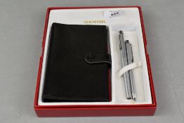 A boxed Sheaffer Targa aeromatic fill fountain pen and ballpoint pen set in silver with note pad