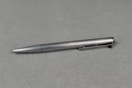 A Montblanc ballpoint pen in brushed steel (some scratches and dents)