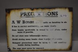 A vintage enamel military sign for Bomb precautions