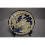 An early Victorian Stanley creamware plate with bird and crest design