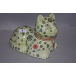 A Chinese porcelain figure of a cat with a millefiori style design bearing red seal mark to base