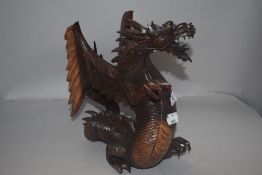 A modern Chinese style carved wood dragon figure