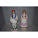 A pair of mid century Spanish Metaxa Greek ceramic decanters