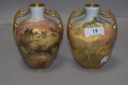 A pair of Royal Doulton Burslem J Hughes hand painted vase with views of Harlech Castle HB8065