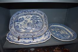 Three antique blue and white ware chargers or serving dishes