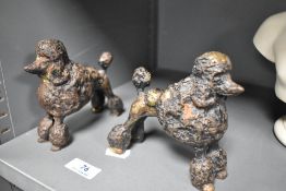 A pair of 20th century bronze cast figure studies of two French Poodles