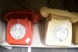 Two mid century GPO telephone sets in red and cream