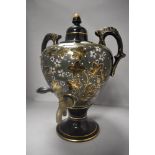 A Victorian samovar having ceramic body with Aesthetic floral design