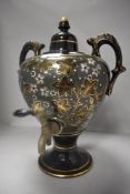 A Victorian samovar having ceramic body with Aesthetic floral design
