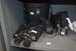 Three pairs of modern binoculars including Mark Scheffel 10-30x50 Zoom all having cases