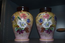 A pair of late Victorian glass vase having mirrored decoration of flowers on pink ground