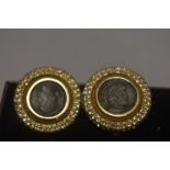 A pair of modern clip on earrings with Roman style coins inserted