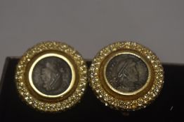 A pair of modern clip on earrings with Roman style coins inserted