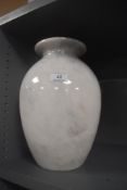 A very heavy set modern marble stone vase with fluted neck