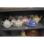 A good selection of antique and later tea pots including a Chinese export porcelain and hand painted