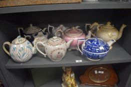 A good selection of antique and later tea pots including a Chinese export porcelain and hand painted