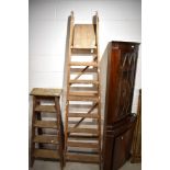 A large set of wooden stepladders