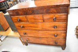 A Victorian mahogany chest of drawers, having blind frieze drawer over three short and three long