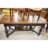 A period oak refectory style table having carved frieze drawers, possibly later or refurbished top