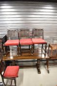 A Priory style refectory table and four similar chairs
