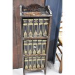 An early to mid 20th Century oak narrow bookcase , with set of Dickens novels published by Waverley