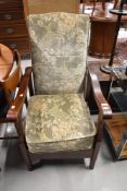 A vintage stained frame easy chair