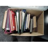 A box of World Stamp Albums, mainly used in 18 albums, stock books and ring binders