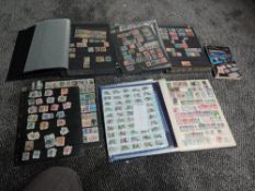 Two stockbooks and a folder of USA Stamps and a stockbook and five stock cards of Italy Stamps, mint