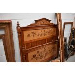 A Victorian pitch pine bed frame and similar wardrobe/display having marquetry work panels