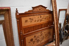A Victorian pitch pine bed frame and similar wardrobe/display having marquetry work panels