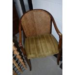 An early 20th Century mahogany framed armchair having upholstered seat and bergere back
