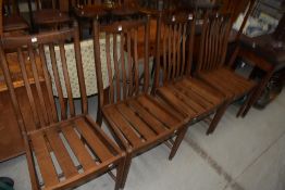 A set of Ercol dining chairs dark stained dining chairs, in a simple style